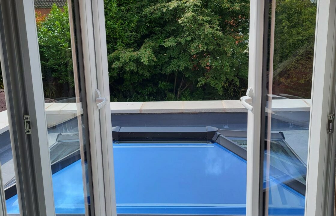 UPVC windows open to a tree and roof